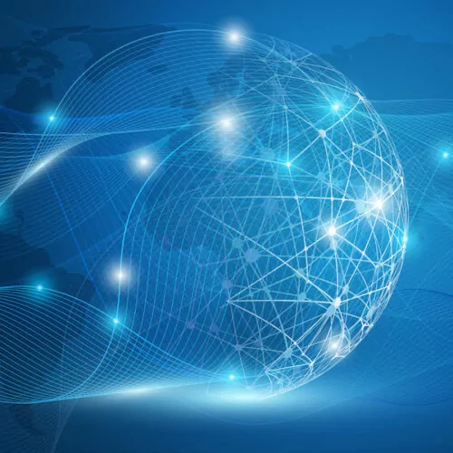 世界的なつながりを象徴する、青い光の線でつながった光る地球儀