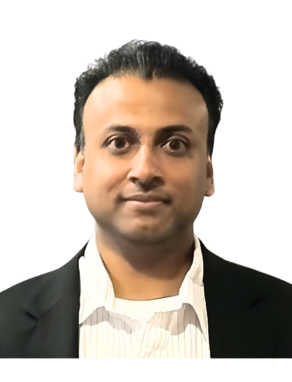 Raj in a formal suit, neutral expression, white background
