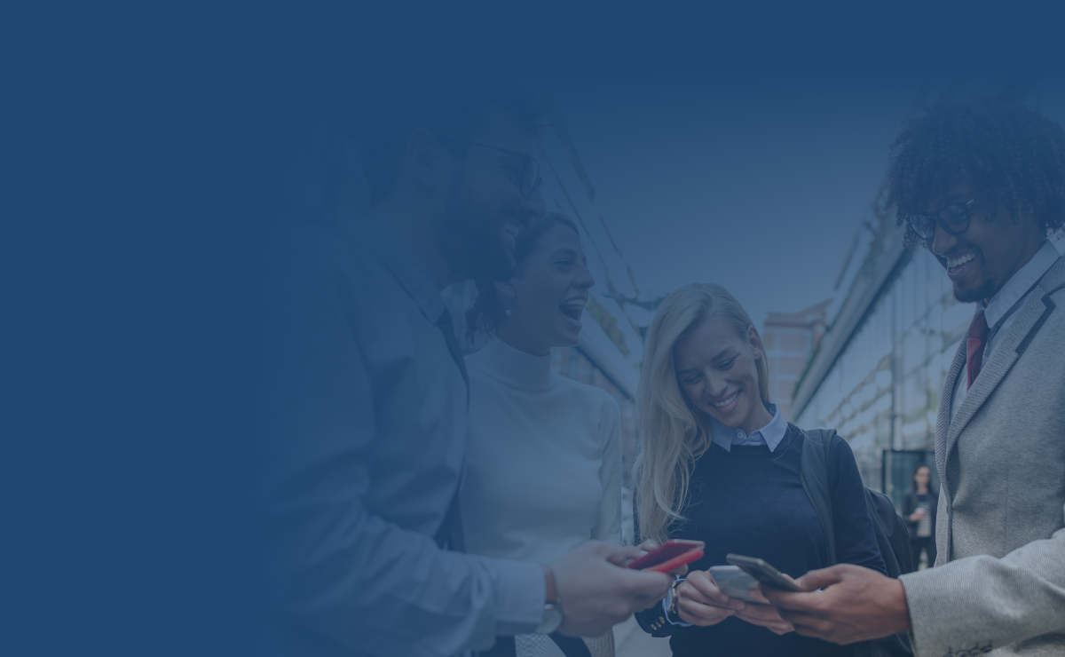 Group of people smiling at smartphones