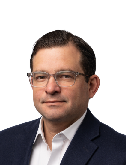 Joe Harar in a suit and glasses