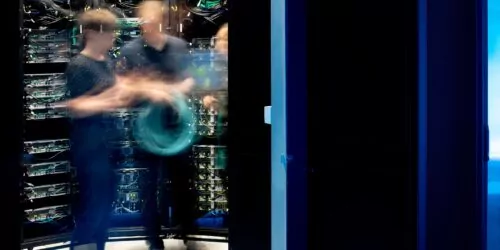 Motion Blur of Group of IT Engineers in Server Room.